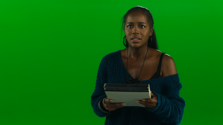 Actress Aja Naomi King in a greenscreen shot from A Little White Lie