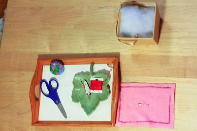 Montessori 'pillow making' activity tray for children