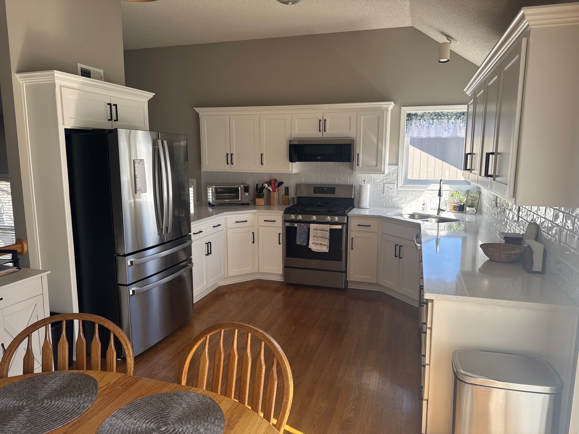 Finished kitchen complete with quartz countertops, shaker doors and new backsplash