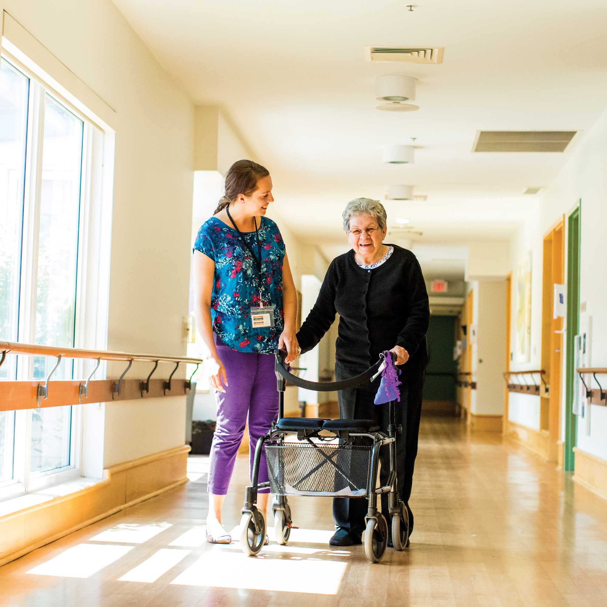Woman walking with caregiver