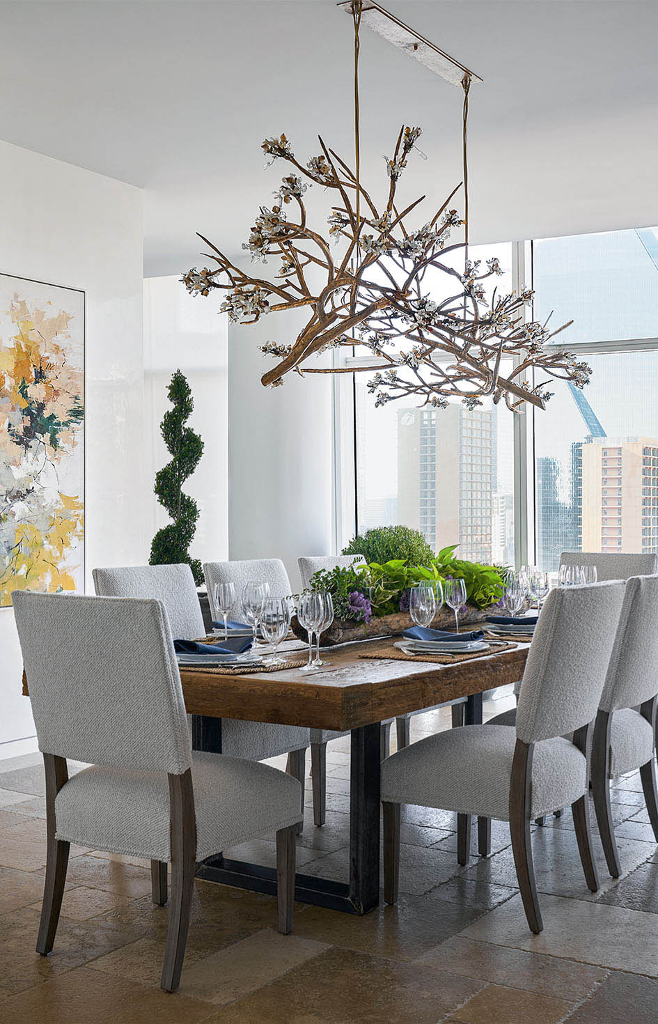 A Bernbaum/Magadini Architects modern comfortable contemporary in Museum Tower high-rise in downtown Dallas, Texas featuring a formal dining areas with extensive views of downtown.