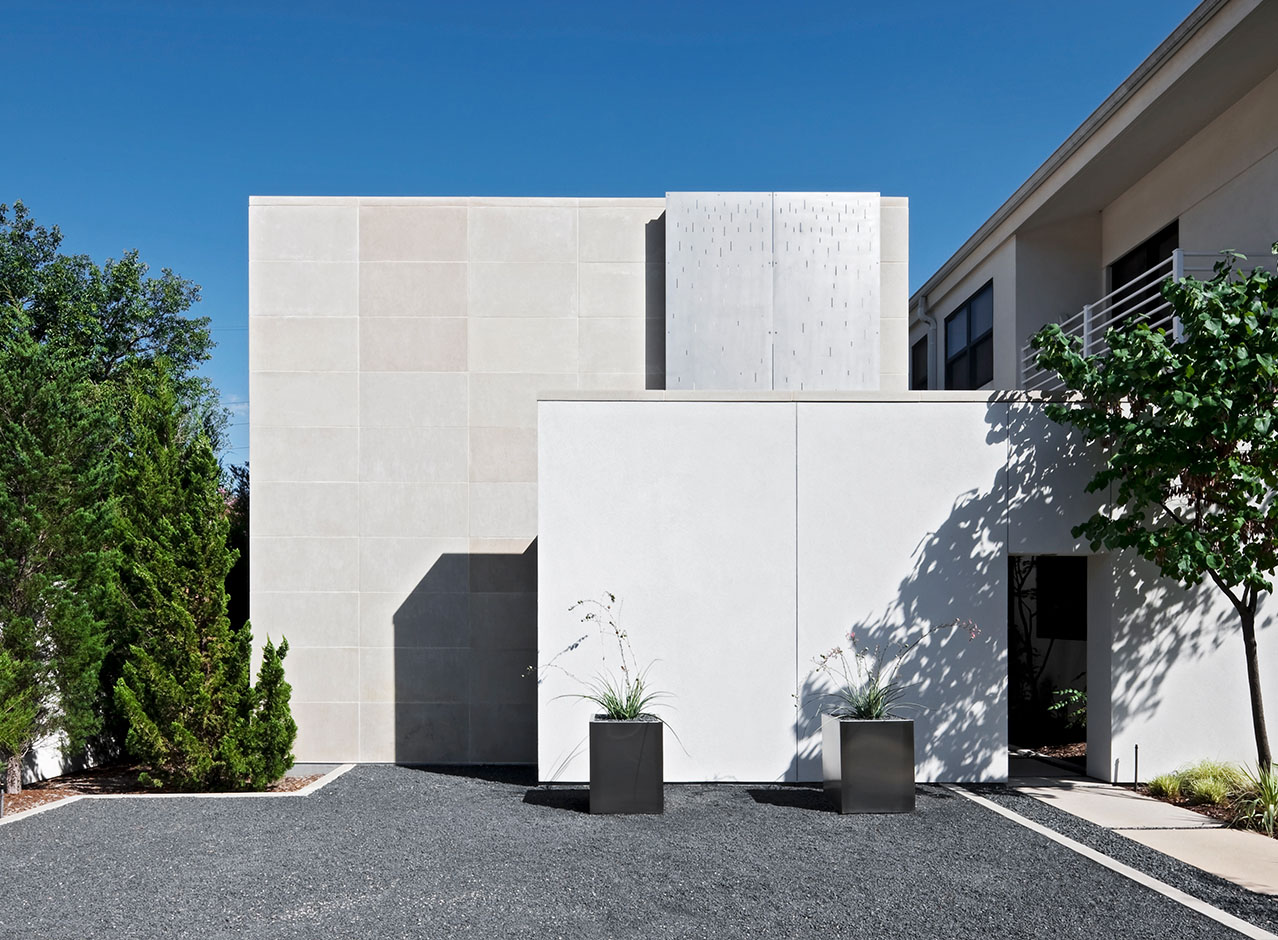 A Bernbaum/Magadini Architects modern contemporary exterior featuring sleek, clean lines and neutral gray palette of complimentary stone materials.